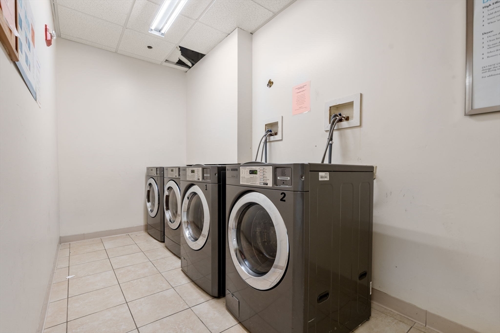 327 Centre Street, Unit 308 Boston, MA 02130 - Photo 10 of 13 a utility room with dryer and washer