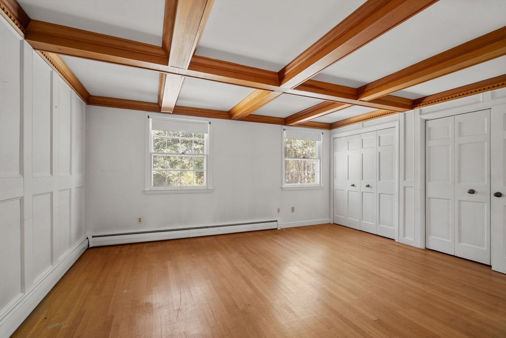 91 Glen Street Natick, MA 01760 - Photo 12 of 39 an empty room with wooden floor and windows