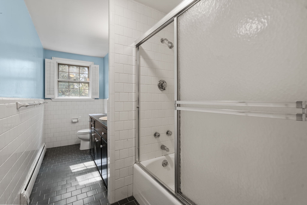 91 Glen Street Natick, MA 01760 - Photo 19 of 39 a bathroom with a tub and a shower