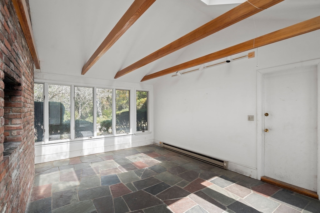 91 Glen Street Natick, MA 01760 - Photo 27 of 39 a view of an empty room with a window