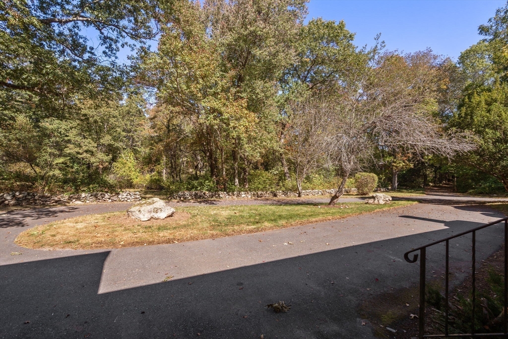 91 Glen Street Natick, MA 01760 - Photo 35 of 39 a view of a yard with wooden fence