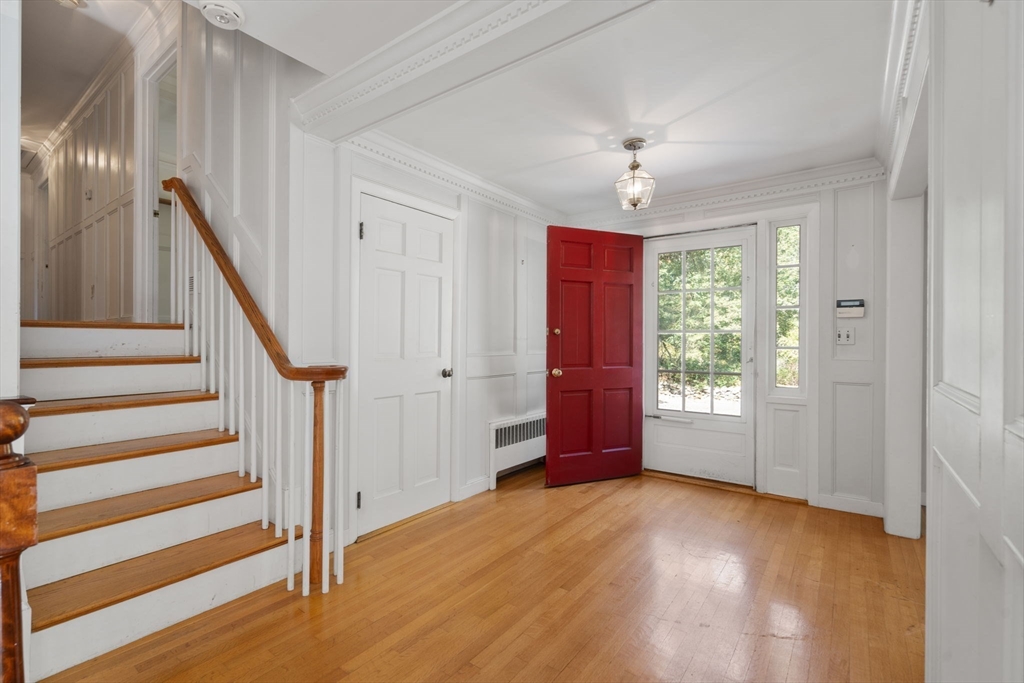 91 Glen Street Natick, MA 01760 - Photo 4 of 39 a view of entryway with wooden floor and stair