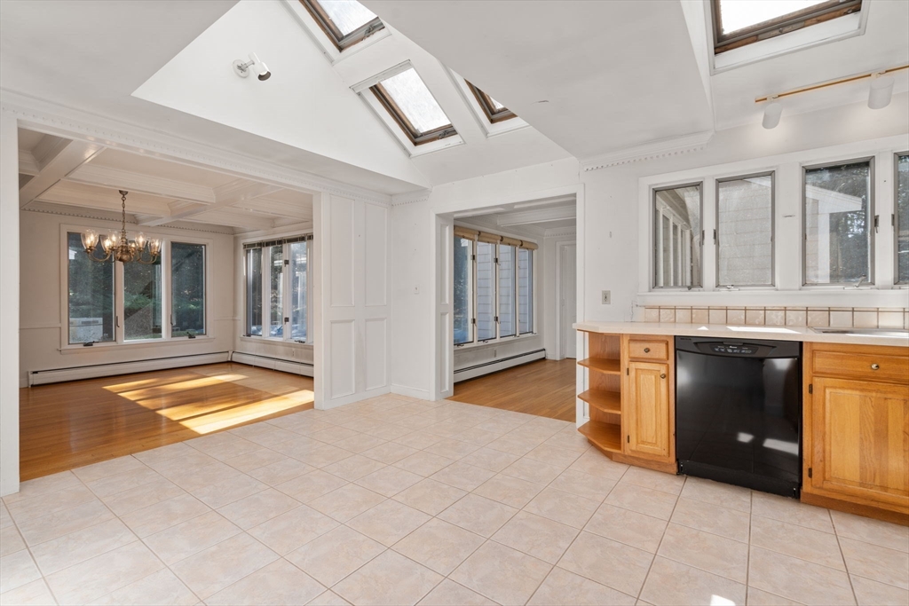 91 Glen Street Natick, MA 01760 - Photo 8 of 39 a view of an empty room with a fireplace