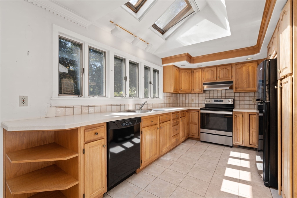 91 Glen Street Natick, MA 01760 - Photo 9 of 39 a kitchen with stainless steel appliances granite countertop a stove and a sink