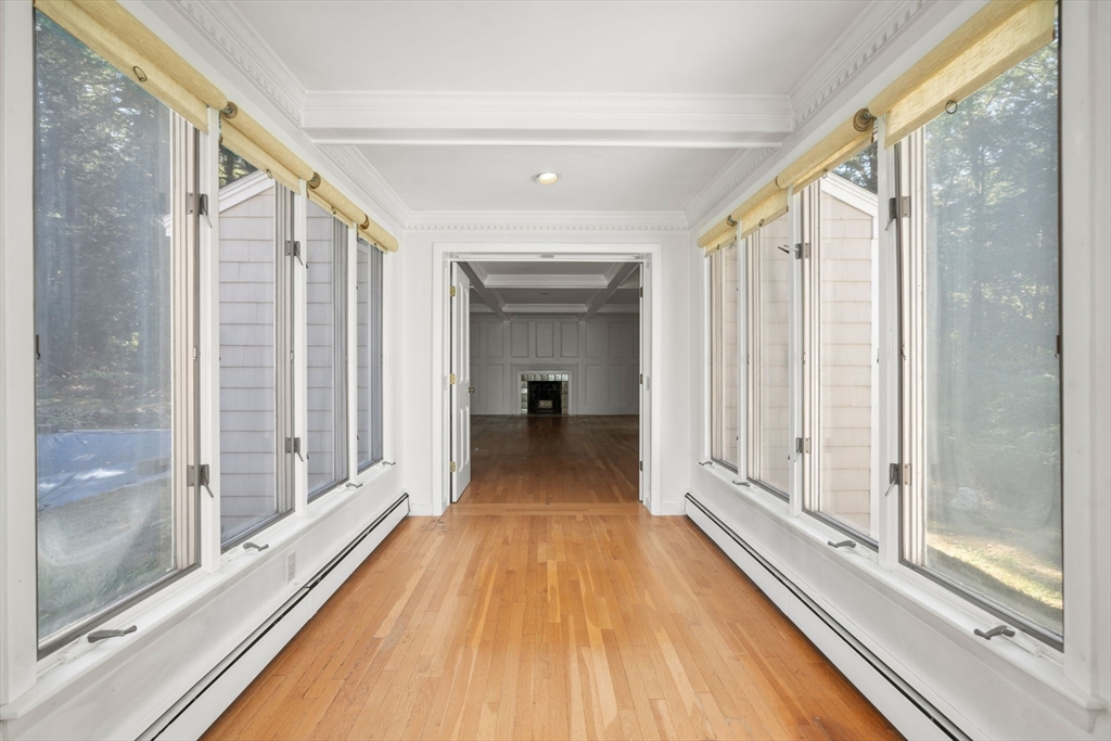 91 Glen Street Natick, MA 01760 - Photo 10 of 39 a view of a room with wooden floor and windows