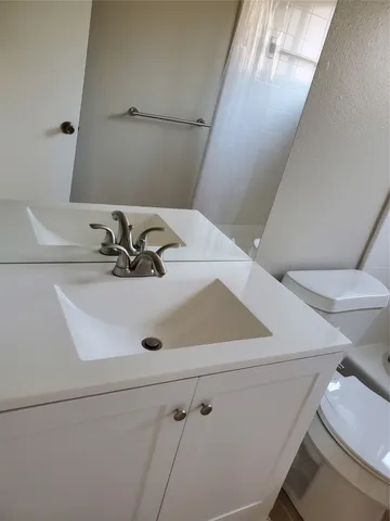 a bathroom with a sink and a toilet