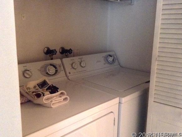 232 North Ridgewood Avenue, Unit A5 Edgewater, FL 32132 - Photo 13 of 15 a bathroom with a sink and a mirror