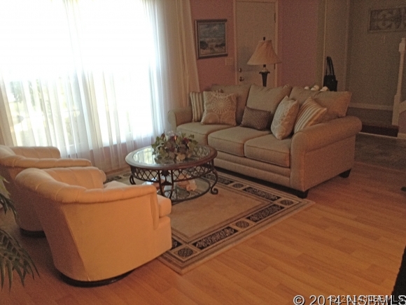 232 North Ridgewood Avenue, Unit A5 Edgewater, FL 32132 - Photo 3 of 15 a living room with furniture