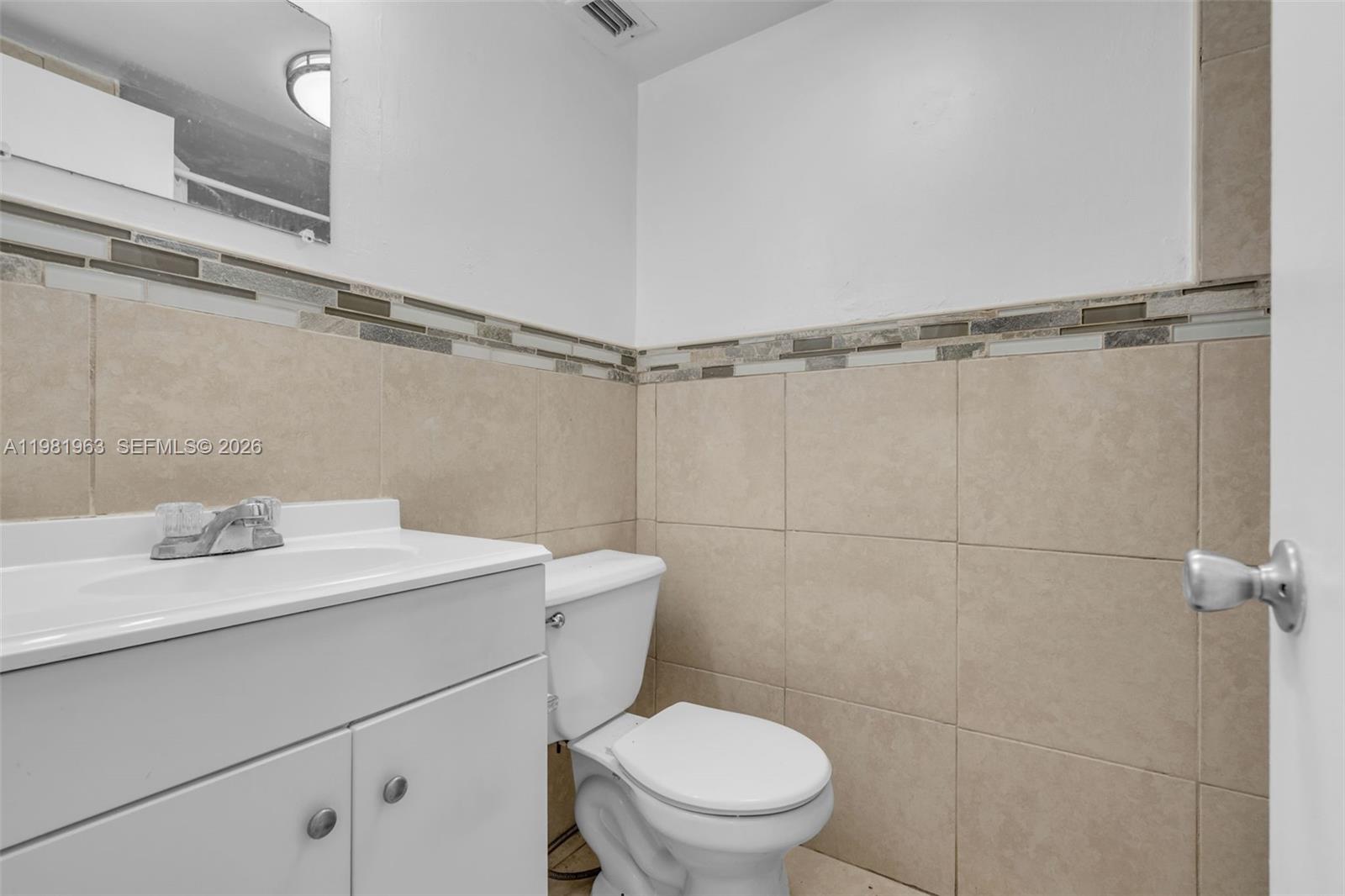 9143 Southwest 77th Avenue, Unit B710 Miami, FL 33156 - Photo 13 of 28 a bathroom with a sink a toilet and shower
