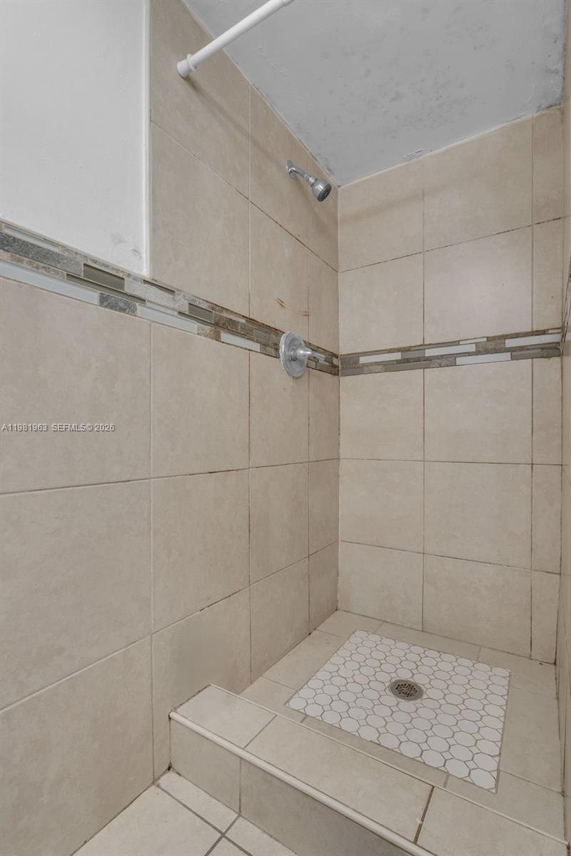 9143 Southwest 77th Avenue, Unit B710 Miami, FL 33156 - Photo 14 of 28 a bathroom with a shower