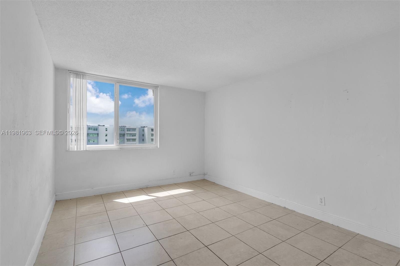 9143 Southwest 77th Avenue, Unit B710 Miami, FL 33156 - Photo 15 of 28 an empty room with windows