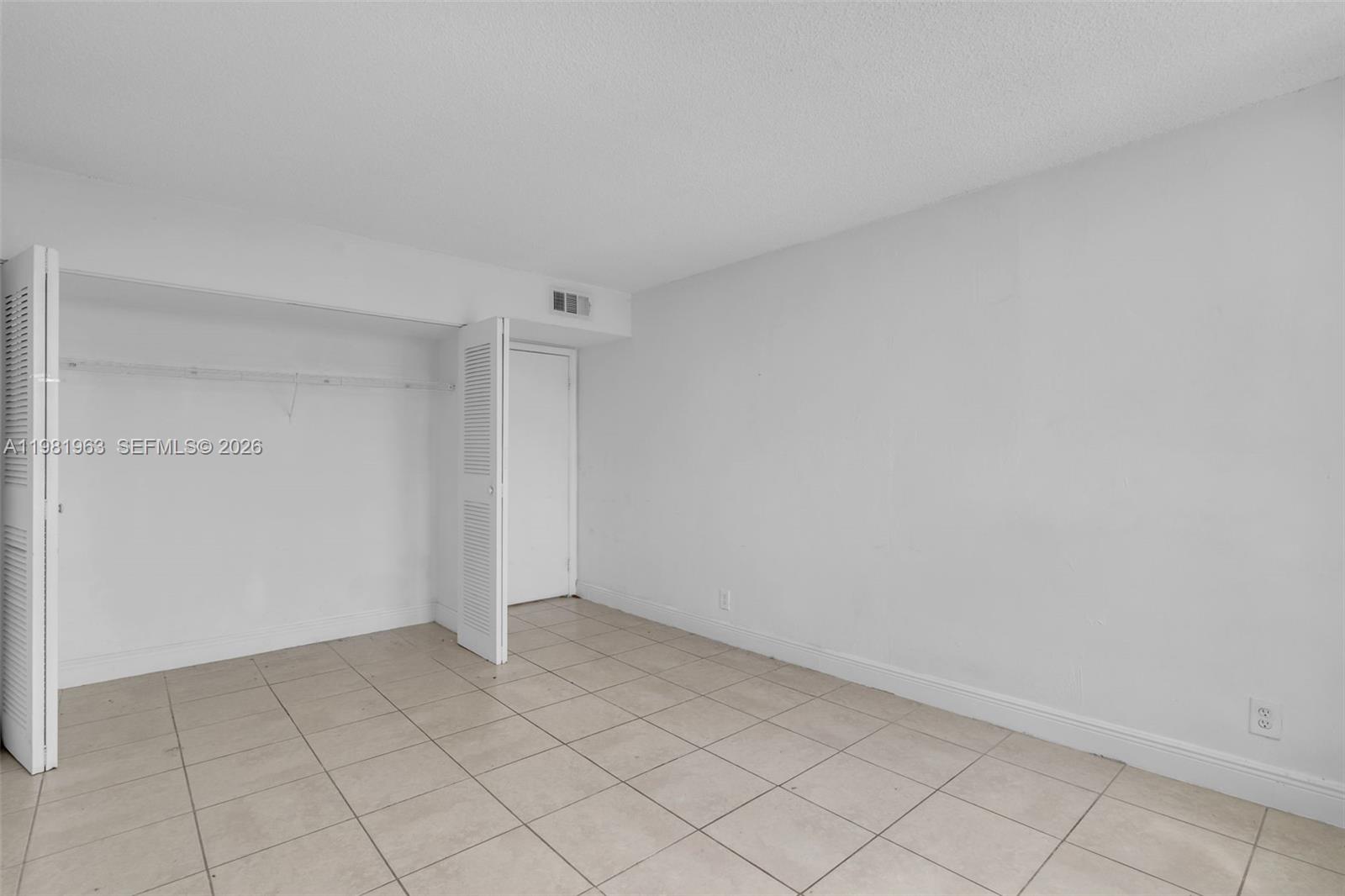 9143 Southwest 77th Avenue, Unit B710 Miami, FL 33156 - Photo 16 of 28 a view of an empty room
