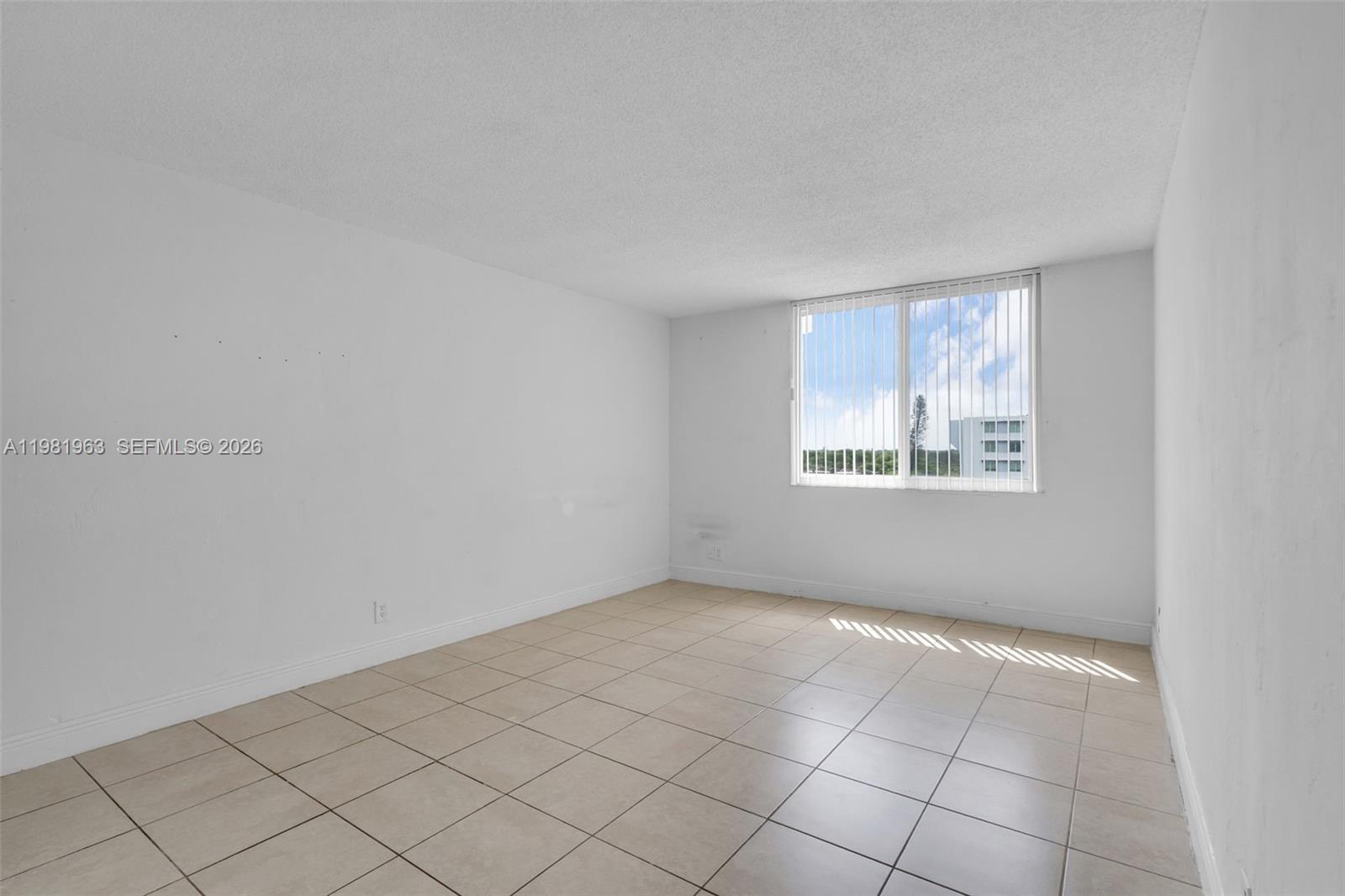 9143 Southwest 77th Avenue, Unit B710 Miami, FL 33156 - Photo 17 of 28 an empty room with windows