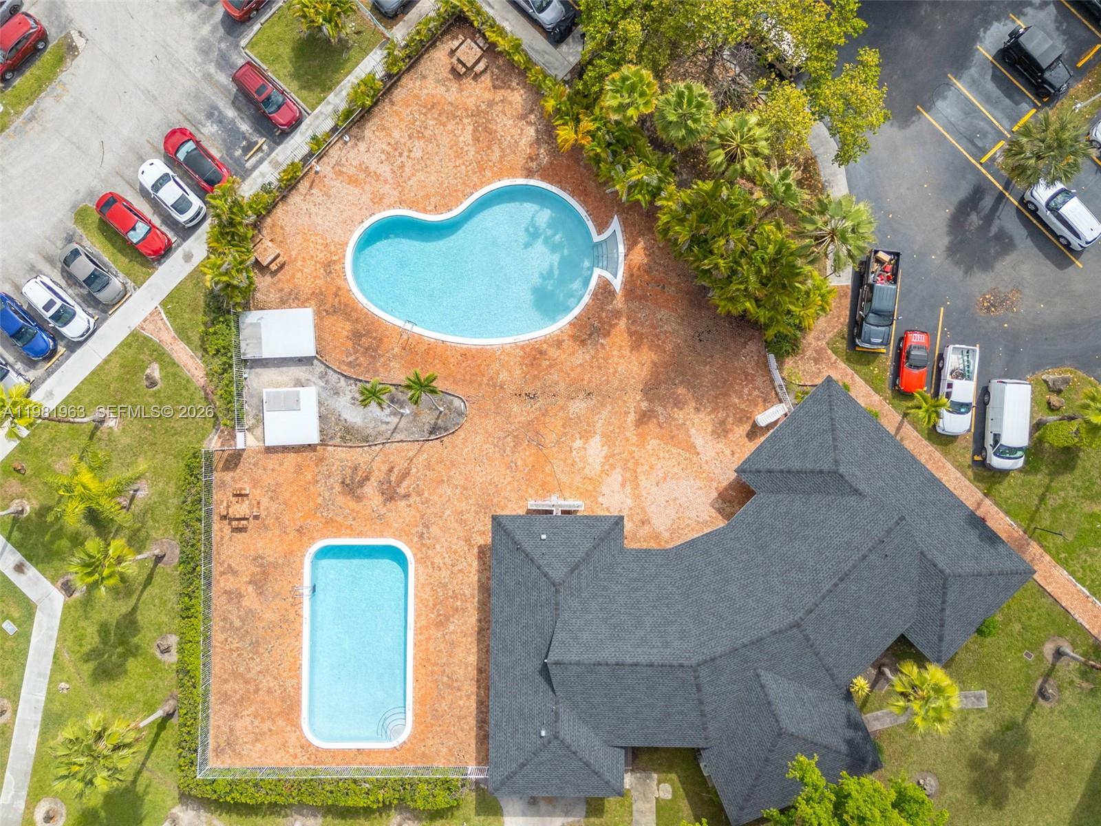 9143 Southwest 77th Avenue, Unit B710 Miami, FL 33156 - Photo 21 of 28 an aerial view of a house with swimming pool and sitting space