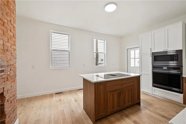 a kitchen with a stove a sink and a refrigerator