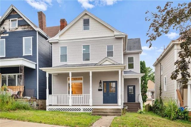 front view of a house with a yard