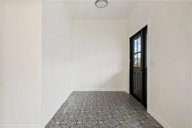 a view of hallway with wooden floor