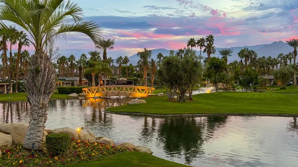 a view of a lake with a building in the background