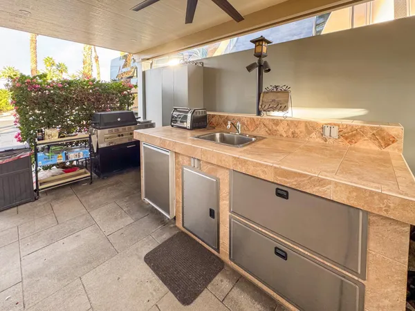 a kitchen with a sink and cabinets