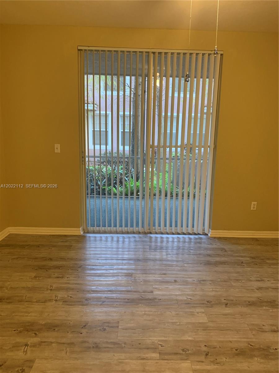 6572 West Sample Road, Unit 6572 Coral Springs, FL 33067 - Photo 11 of 17 a view of wooden floor