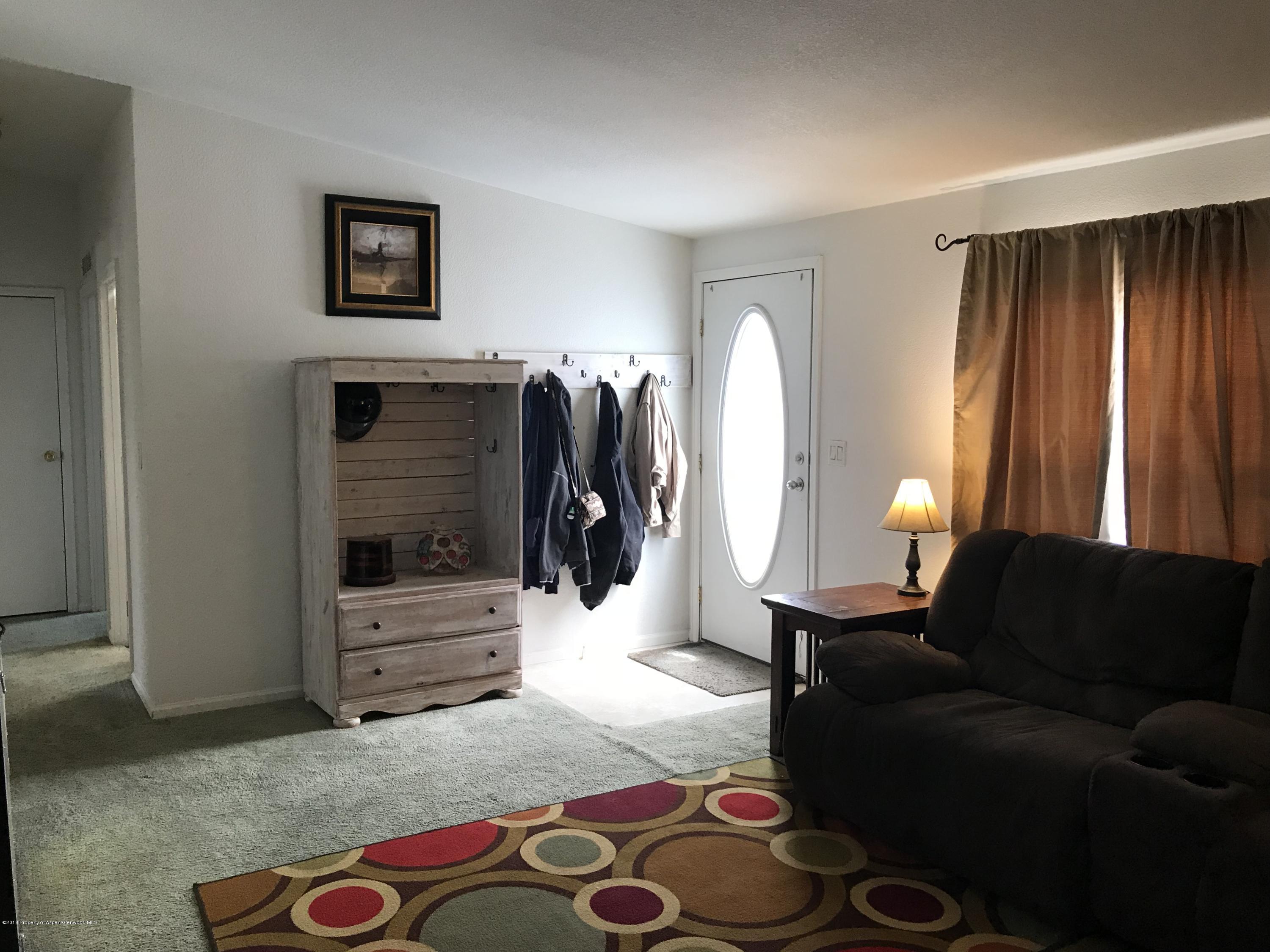 200 West 20th Street, Unit D4 Rifle, CO 81650 - Photo 3 of 23 a living room with furniture and a window