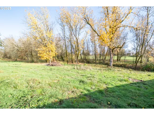 a view of a house with swimming pool and sitting area