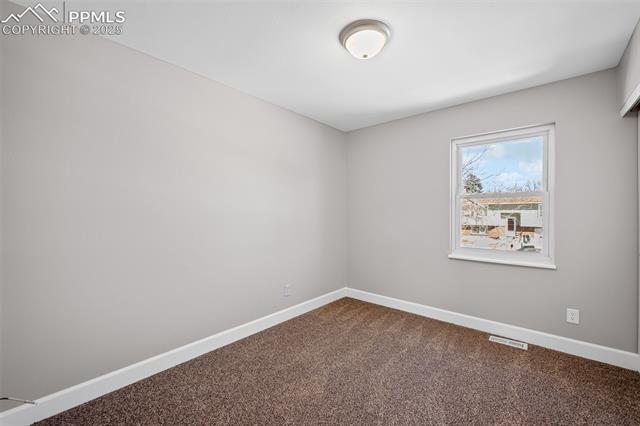 6319 Chippewa Road Colorado Springs, CO 80915 - Photo 26 of 36 View of carpeted empty room