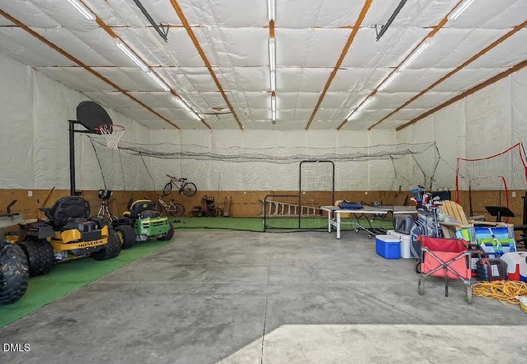 5780 McArthur Road Broadway, NC 27505 - Photo 38 of 40 a view of a garage with a table and chairs