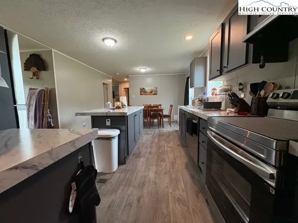 a kitchen with a sink appliances and cabinets