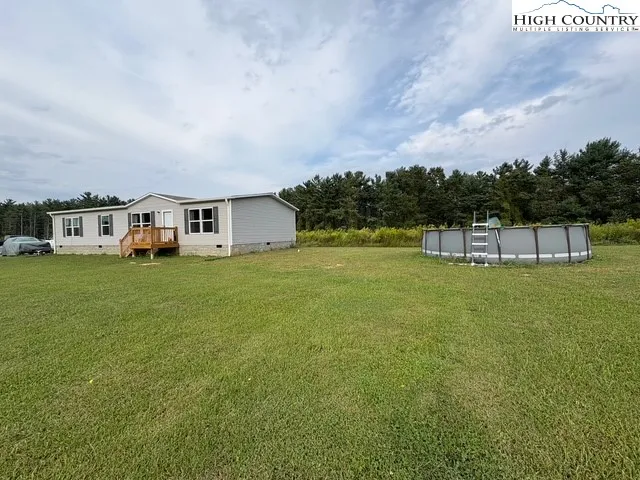 a view of a house with a big yard