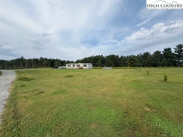 a view of a lake with houses in the back