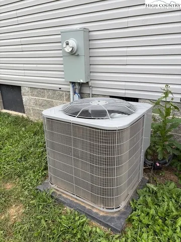 a view of house with backyard and garden