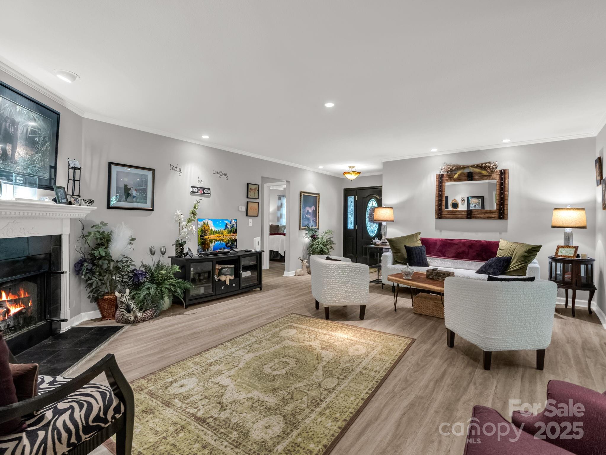 134 Downing Place Lake Lure, NC 28746 - Photo 5 of 35 a living room with furniture and a fireplace