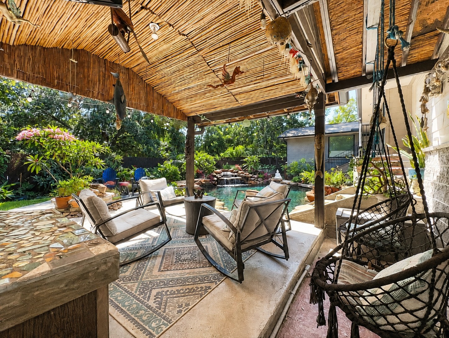 5 Tree Frog Drive Houston, TX 77074 - Photo 21 of 25 a view of patio with couches and chairs under an umbrella