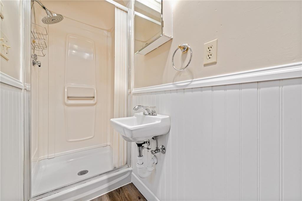 709 Indian Hill Road Rostraver Township, PA 15012 - Photo 20 of 25 a bathroom with a sink a shower and a mirror