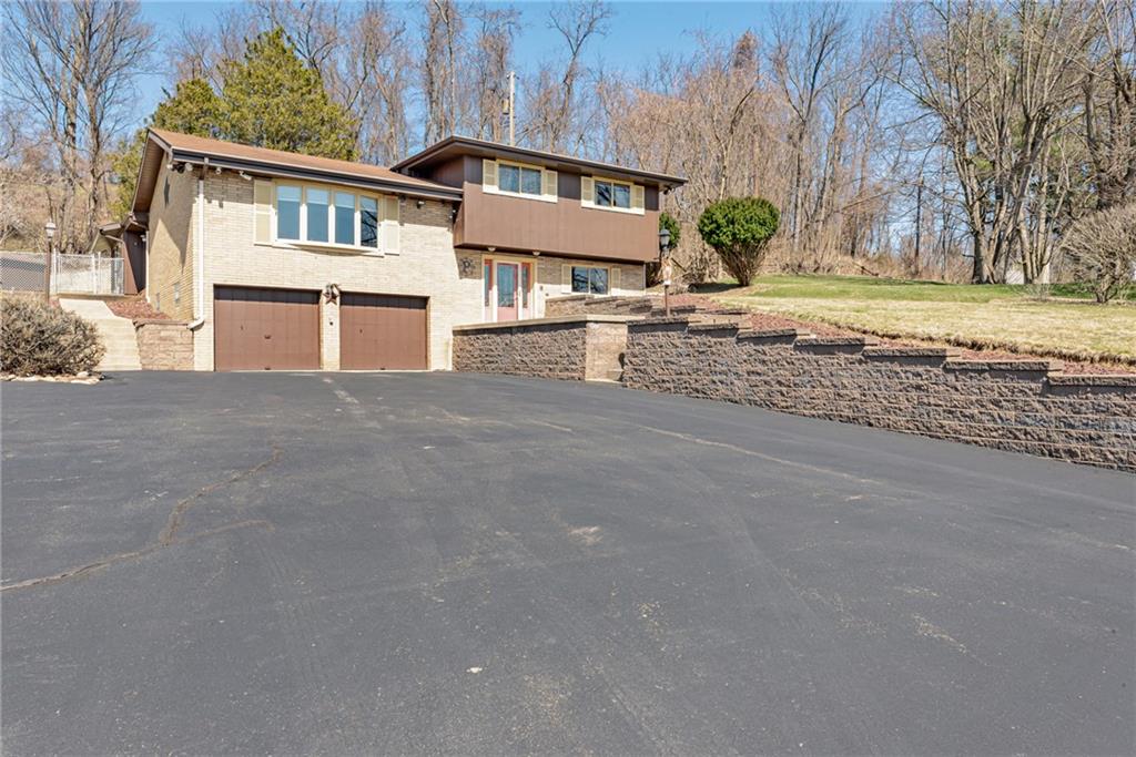 709 Indian Hill Road Rostraver Township, PA 15012 - Photo 2 of 25 a view of a house with a yard and large tree