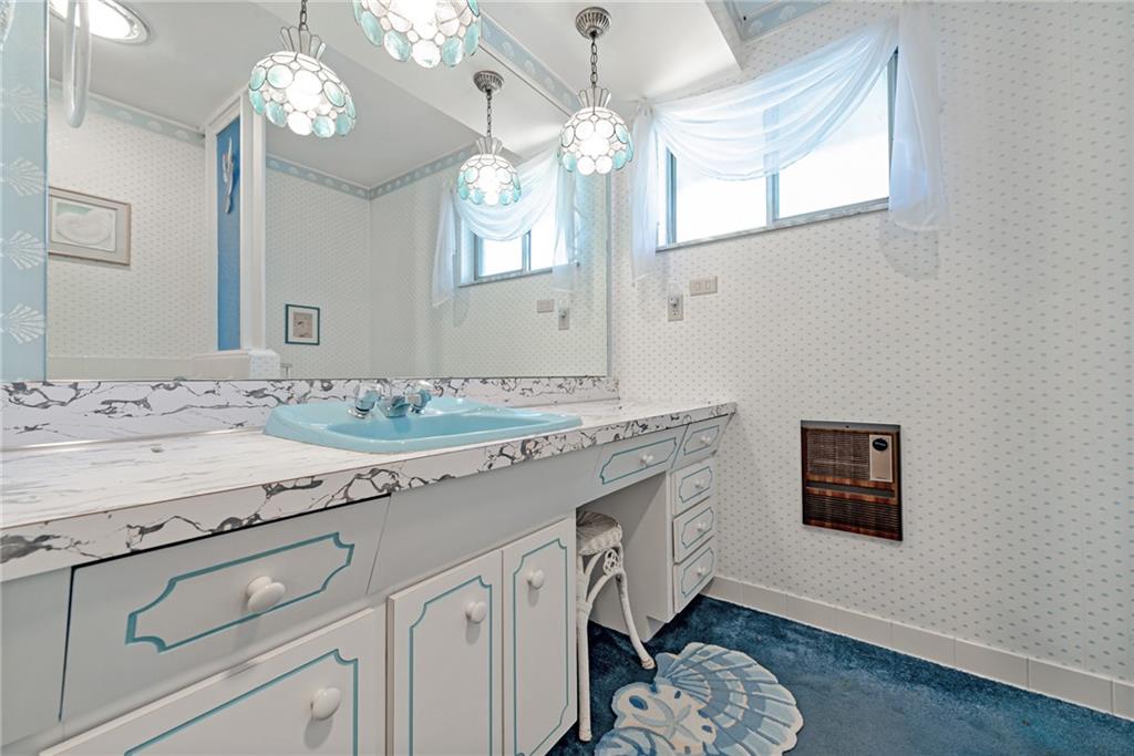 709 Indian Hill Road Rostraver Township, PA 15012 - Photo 25 of 25 a bathroom with a sink a mirror and a light fixture