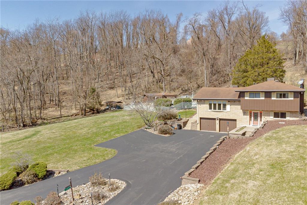 709 Indian Hill Road Rostraver Township, PA 15012 - Photo 4 of 25 a view of a house with a yard and sitting area