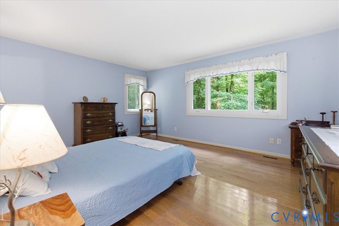 4099 Doe Run Road Hopewell, VA 23860 - Photo 15 of 36 Hardwood flooring throughout featuring light blue