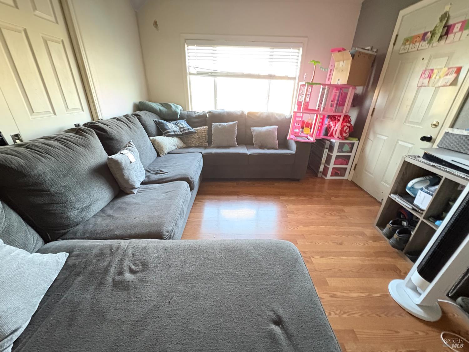 313 Roney Avenue Vallejo, CA 94590 - Photo 18 of 26 a living room with furniture and a flat screen tv