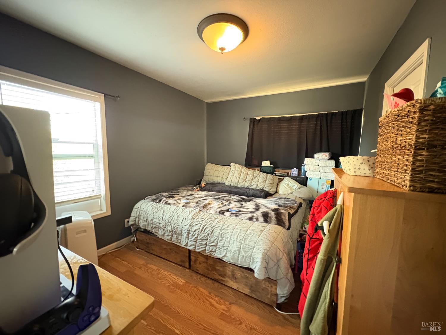 313 Roney Avenue Vallejo, CA 94590 - Photo 19 of 26 a bedroom with a bed and a window