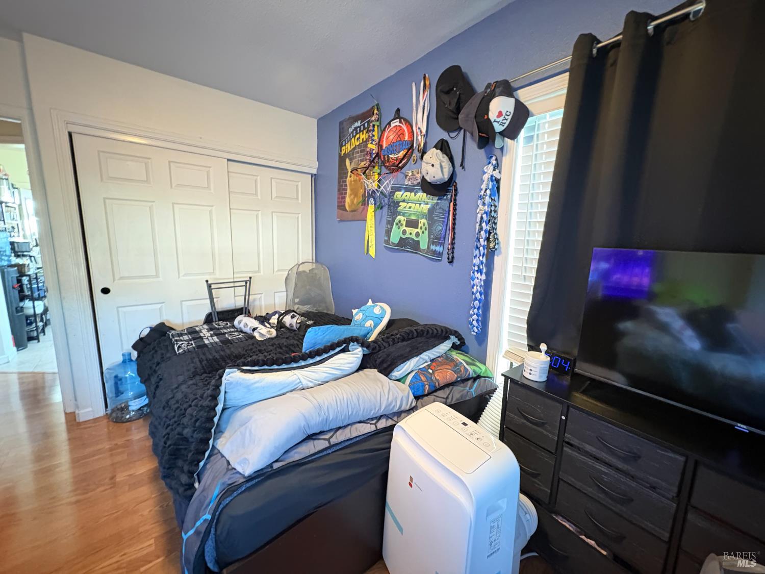 313 Roney Avenue Vallejo, CA 94590 - Photo 20 of 26 a bed room with two beds and a painting on the wall