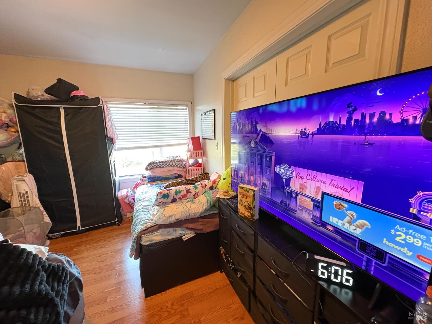 313 Roney Avenue Vallejo, CA 94590 - Photo 24 of 26 a bedroom with a bed and a window