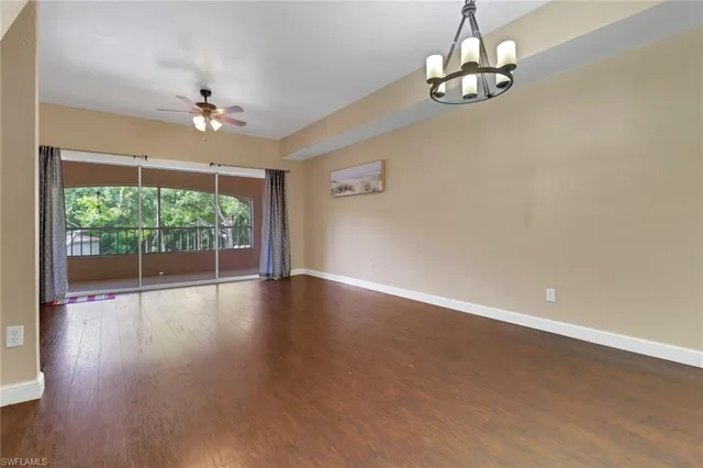 a view of livingroom with hardwood floor and ceiling fan