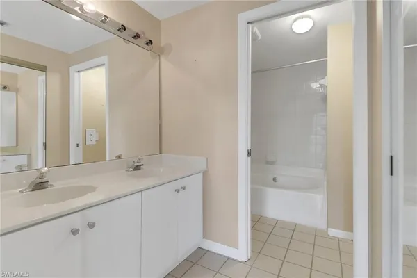 an empty room with windows and entrance