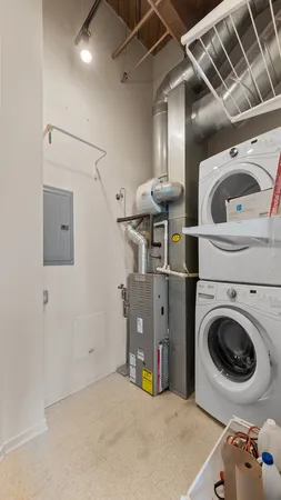 a view of a storage & utility room with two washing machine