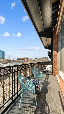a view of balcony with furniture