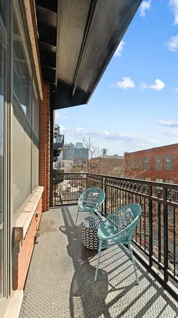 a view of a balcony with wooden floor