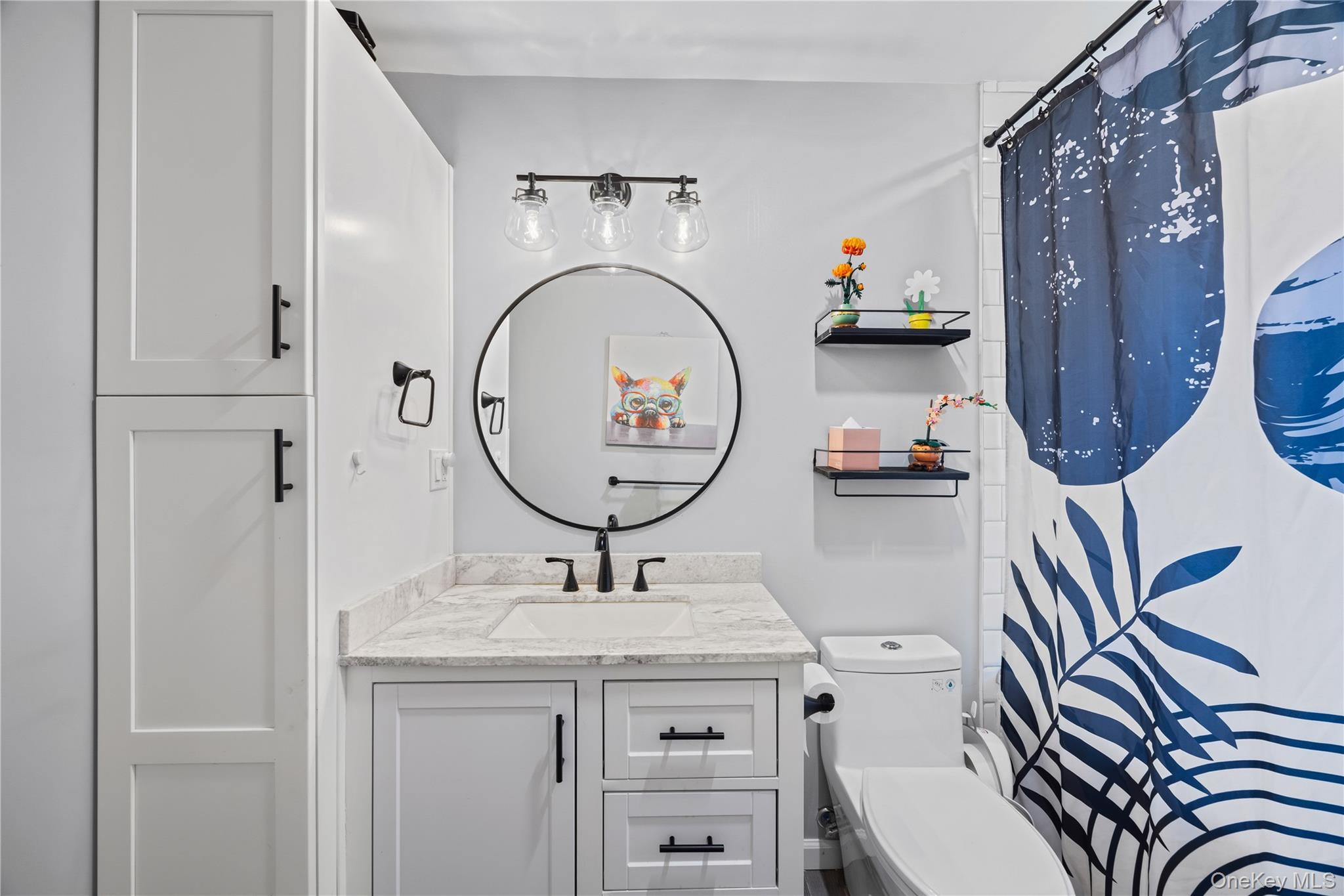 69 Silver Spring Road New Windsor, NY 12553 - Photo 17 of 20 a bathroom with a sink a toilet and a mirror
