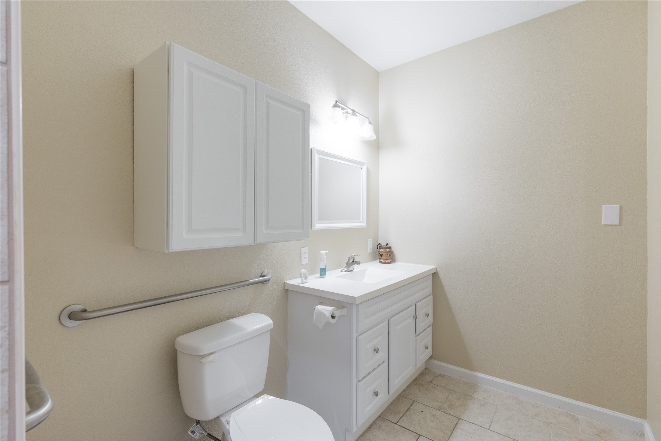 20145 Janak Road Coupland, TX 78615 - Photo 27 of 40 Functional full bathroom with practical vanity and storage in the garage.